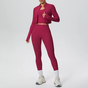 Three-piece magenta yoga set featuring a zip-up jacket with thumbholes and high-waist pants