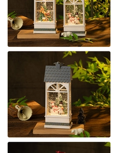 Close-up of vintage Christmas snow globe lantern with glowing light and Santa scene