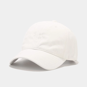 Close-up of a white cotton baseball cap showing detailed fabric texture and stitching