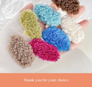 Close-up of colorful plush lamb wool hair clips showing soft texture and various colors