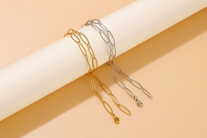 Detail of gold and silver stainless steel oval link chain necklaces with lobster clasp