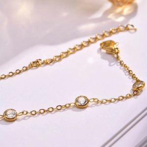 18K gold plated stainless steel bracelet featuring five sparkling white zircon stones