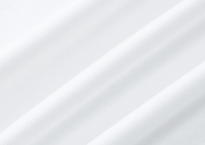 Gros plan sur la texture du tricot blanc avec motif en nid d'abeille et plis de tissu doux