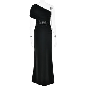 Detail of elegant black one-shoulder dress featuring waist lace patchwork and pleated fabric