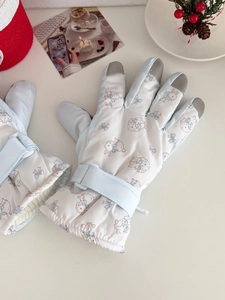 Detail of cute rabbit ski gloves featuring touch screen tips and warm fleece lining