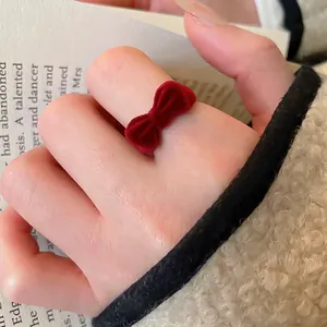 Elegant red flocked bow open ring for women with vintage velvet texture and minimalist style