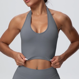 Detail of dark grey halter sports bra with ribbed texture and seamless knit fabric