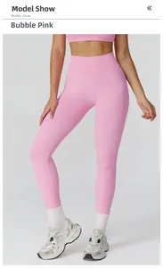 Detail of high waist seamless ribbed yoga pants in bubble pink showing compression fabric