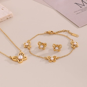 Golden butterfly jewelry set with shell pearls including necklace, bracelet and earrings