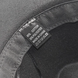 Detail of fedora hat interior showing black sweatband and 65% cotton blend fabric label