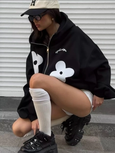 Oversized black floral hoodie with silver zipper detail and heavy cotton texture