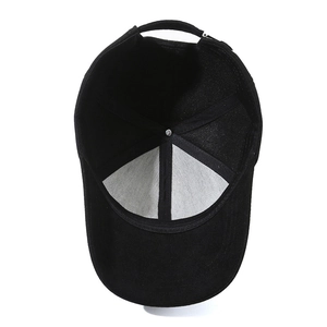Inside view of a black cotton baseball cap showing stitching and adjustable strap