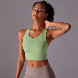 Detail view of avocado green sports bra with wide straps and high-elasticity fabric
