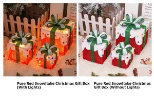 Three glowing Christmas gift boxes with red LED light effects and festive snowflake tops