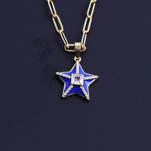 Detailed close-up of a blue enamel star pendant with gold plating and zircon inlay