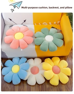 Detail of vibrant daisy floor cushions showing corduroy fabric texture and petal design