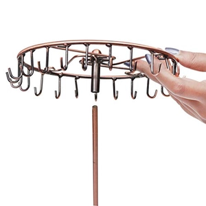 Detail of assembling the copper finish rotating iron necklace and jewelry display stand