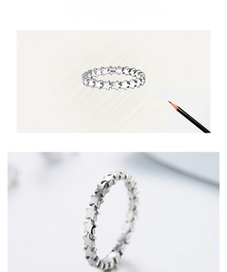 Macro view of S925 sterling silver star ring showing design sketch and fine details