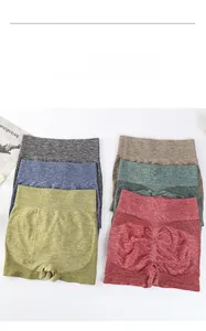 Flat lay of seamless high-waisted yoga shorts in six colors with peach lift texture