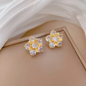 Elegant gold titanium steel five-petal flower stud earrings with shimmering zircons