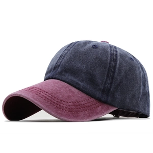 Retro washed cotton baseball cap in navy blue and burgundy shown from a 45-degree angle