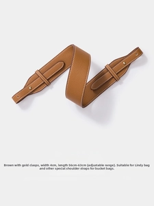 Detail of brown lychee grain leather strap with gold clasps for Lindy bags