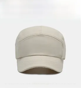 Front view of beige five-panel baseball cap with short brim and decorative stitching