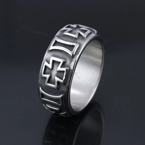 Retro stainless steel cross ring with vintage silver relief on black reflective surface