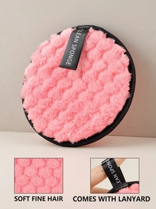 Detailed texture of pink reusable makeup remover sponge with convenient hanging lanyard