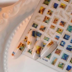 Macro shot of Van Gogh oil painting nail stickers with 3D gold frames on ivory nails