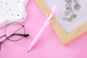 Detailed view of a pink tulip-shaped mechanical pencil on a soft aesthetic background