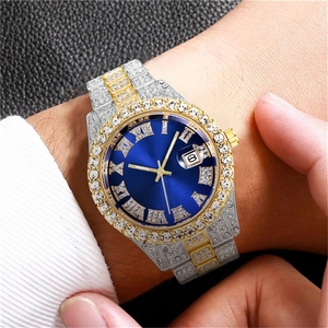 Close-up of luxury iced-out men's watch with blue dial and two-tone diamond strap