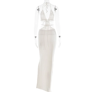 Detail view of a white knitted halter neck bikini top and sheer mini skirt set