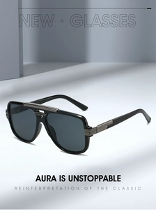 Detail of square sunglasses frame with gun-grey metal accents and dark grey lenses