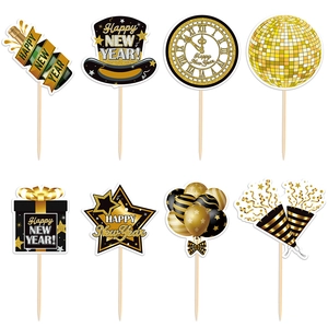 8-piece black and gold Happy New Year cake toppers with festive shapes and glitter accents