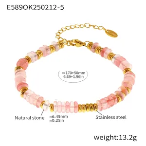 Detail view of pink natural stone beaded bracelet with 18k gold plated steel heart tag
