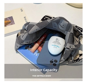 Internal view of the knit panda tote bag showing spacious storage for phone and cosmetics