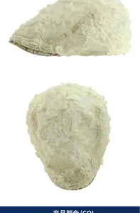 Detailed macro of beige lace beret featuring 3D floral embroidery and mesh texture
