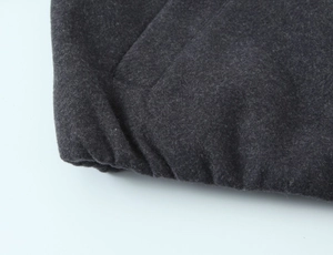 Close-up of charcoal gray wool blend fabric texture on stand collar bomber jacket