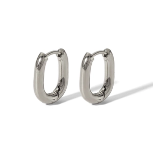 Detailed view of polished silver oval hoop earrings with a secure clasp closure mechanism