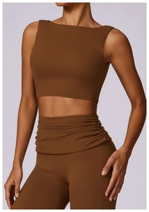 Detailed back view of mocha yoga vest with high-waist ruched leggings showing fabric texture