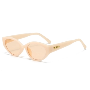 Lunettes de soleil cat eye crème tendance avec verres orange et détails dorés