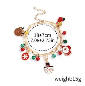 Detailed view of Christmas charm bracelet with Santa, snowman, and reindeer pendants