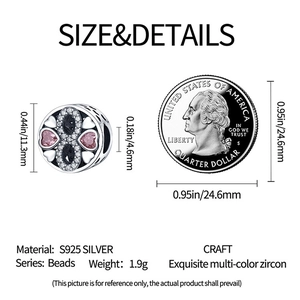 Detail showing infinity charm size with pink heart stones next to a quarter coin
