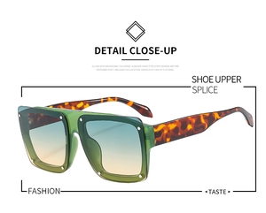 Detail of square oversized sunglasses featuring gradient lenses and tortoiseshell temples