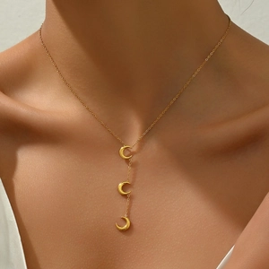 Elegant gold stainless steel triple crescent moon pendant necklace on a model