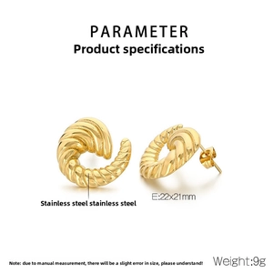 Macro detail of 22x21mm golden stainless steel spiral earrings with ribbed texture