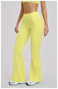 Close-up of high-waist lemon yellow flare leggings with smooth elastic performance fabric