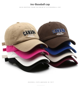 Stacked collection of washed cotton baseball caps in eight vintage colors with embroidery