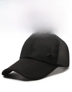 Detail of black mesh baseball cap showing a square mountain logo and breathable texture